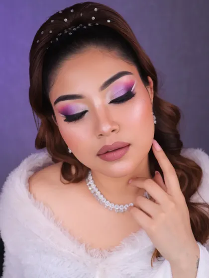 The soft, fluffy wrap adds a touch of winter glam to this creative and colorful makeup look.