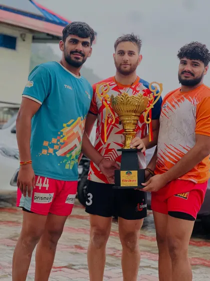 Three of our champion players posing with the trophy after their victory in Himachal. Teamwork is the foundation of our success.