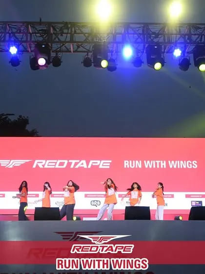 A race is also a celebration. I incorporate entertainment and engagement, like this professional dance performance on the main stage, to create a complete festival atmosphere that keeps the energy high for participants and spectators.