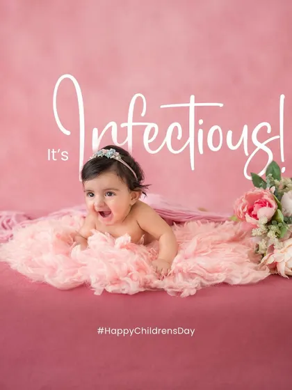 An infectious smile. This baby's joyful expression is simply contagious. Her happy face and cute pose make for a perfect milestone portrait.