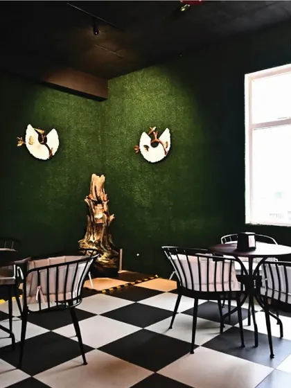 A look at one of my themed seating areas, with a checkerboard floor and unique wall decor. Every corner has its own personality.