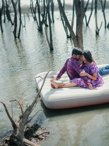 A romantic and intimate moment on the floating mattress. This unique lake photoshoot concept is perfect for adventurous couples.