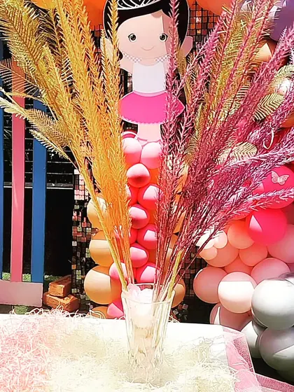 Dried floral arrangements in bright colors add a sophisticated and beautiful touch to the Ballerina theme table decor.