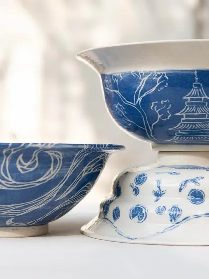 These tastefully made ramen bowls were created by our Foundation students. They are beautifully decorated with detailed sgraffito work inspired by Japanese patterns, landscapes, and culture, turning a functional item into a piece of art.