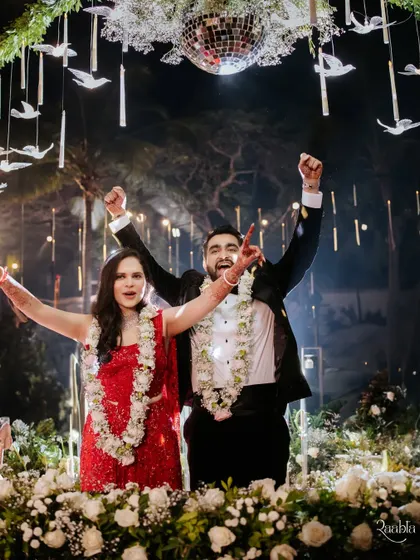 A triumphant cheer from the newlyweds after their varmala, celebrating the official start of their life together.