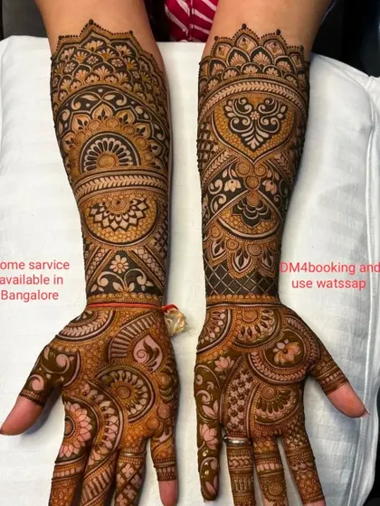 This design is a beautiful example of Marwadi style, with fine lines and intricate details. The central mandala is surrounded by delicate patterns.