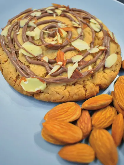 This is not your regular cookie. My Almond Croissant Cookie is soft and golden, filled with a rich chocolate frangipane and topped with toasted almond slivers for a buttery crunch.