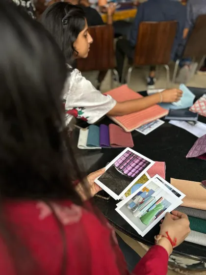 Examining inspiration photos and materials.