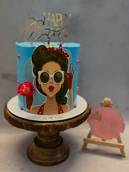 This cake has a chic, retro vibe with a pop-art style illustration of a woman. It's a stylish and artistic choice for a birthday celebration.