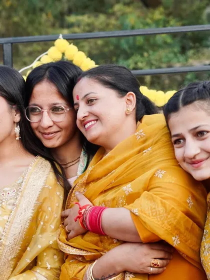 A candid group photo of smiling women enjoying the haldi function. These are the real moments of connection and friendship that I love to photograph.