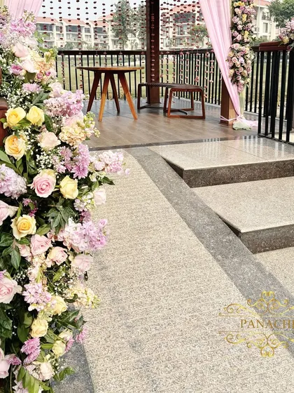 A close-up of the floral decor on the gazebo railing.