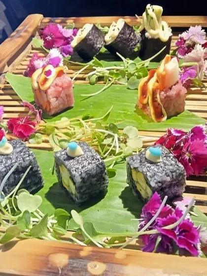 A close-up of our sushi presentation, where each piece is a work of art. We use fresh ingredients and edible flowers to create a visually stunning platter that is perfect for high-end events.