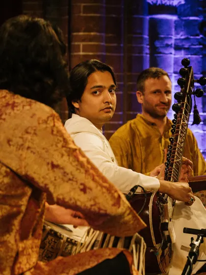 A candid moment on stage in Amsterdam, sharing a glance with my fellow musicians. The connection between artists is key to creating a cohesive and soulful performance.