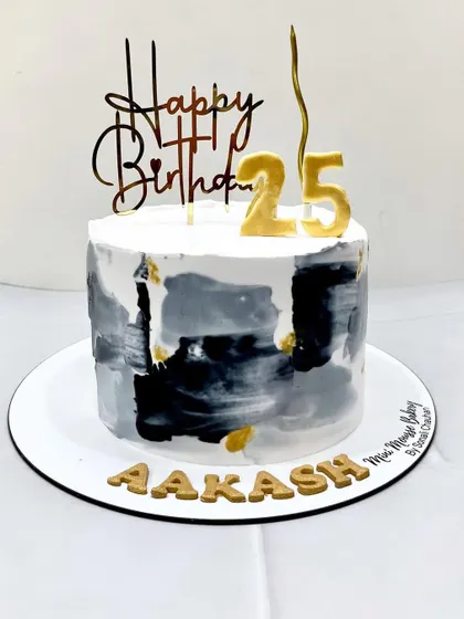 A modern cake with a grey and black painted effect, accented with gold leaf. The edible gold letters and number '25' topper complete this stylish 25th birthday cake.
