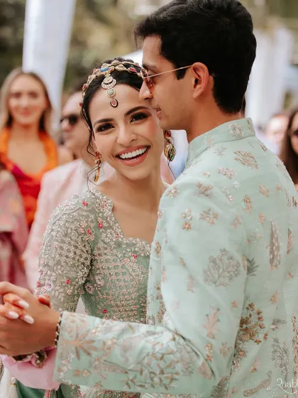A candid shot of the happy couple dancing during their welcome lunch at Umaid Bhawan Palace.