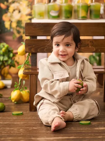 A happy customer at our fresh lemonade stand. This themed session provides many opportunities for cute and interactive baby photos.