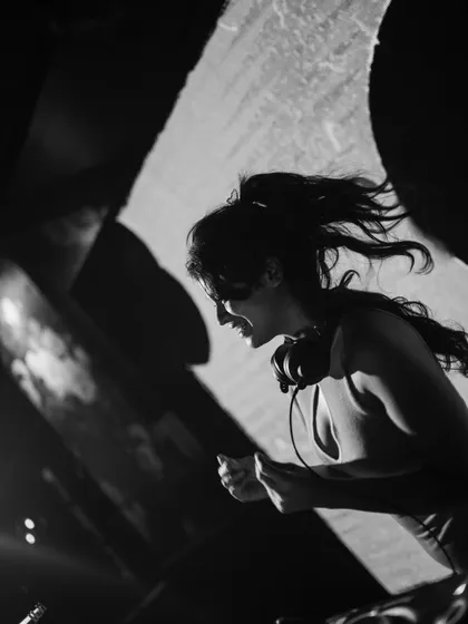 A black and white shot that captures the raw energy of a live performance. I use the mic to hype the crowd and make sure everyone feels like part of the show.