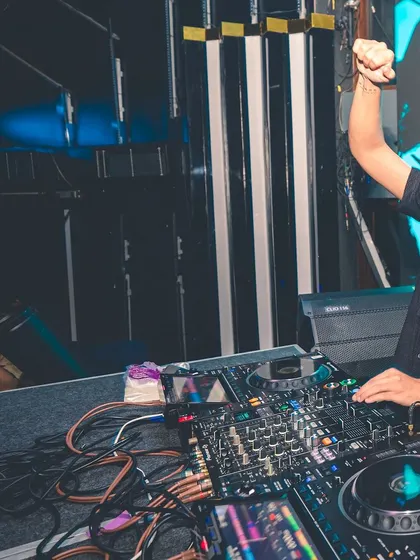 Fist in the air, feeling the beat. A candid moment of me enjoying the music as much as the crowd does.