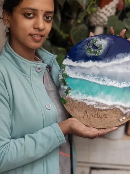 Here I am holding the completed 'Aadya' nameplate. Each piece is handcrafted with care, ensuring the final result is a beautiful and high-quality piece of art.