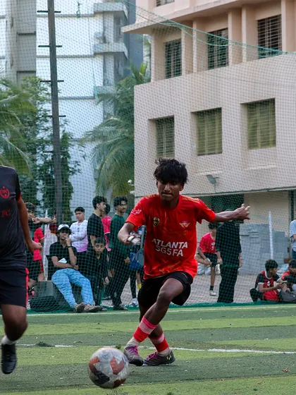An action shot showing a player skillfully maneuvering past a defender in a competitive match.