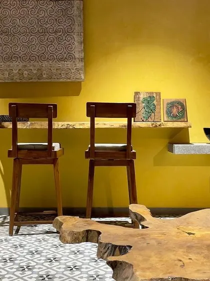 A duplicate image highlighting the eclectic mix of furniture and decor on the residential terrace.