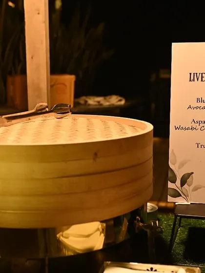 Our live sushi station, featuring a menu of Blue Pea Flower Sushi, Asparagus Tempura Sushi, and Truffle Shiitake Sushi, ready to delight guests.
