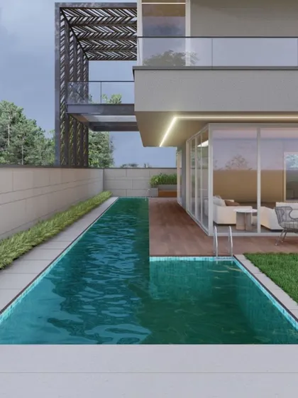 A linear lap pool serves as a refreshing extension of the living space, blurring the line between indoors and out. The design combines a modern architectural pergola with a clean poolside deck for a perfect relaxation zone.