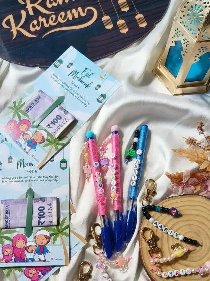 Our complete Eid gift set, including Eidi cards, personalized pens, and custom beaded keychains, set against a festive Ramadan Kareem backdrop.