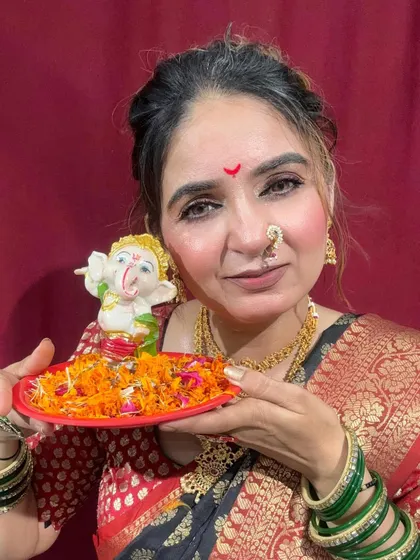 Celebrating Ganesh Chaturthi with a traditional look. The makeup is soft and devotional, with a focus on clean skin and expressive eyes.