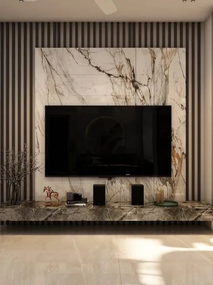 A close-up of the TV unit from the same project, showcasing a beautiful marble backdrop and fluted wall panels for a luxurious and textured look.