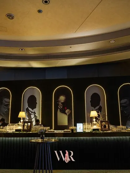The custom-designed bar for the Jazz Club night, featuring portraits of iconic musicians. This was a central feature that immersed guests in the theme of the evening.