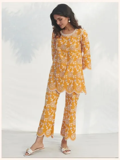 This mustard yellow co-ord set features intricate all-over embroidery. It’s a chic and modern alternative to a traditional kurta set.
