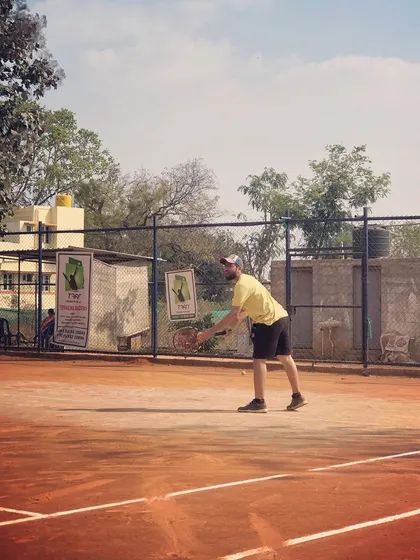 A player returns a serve during the Tennis360 Men's Open Tour.