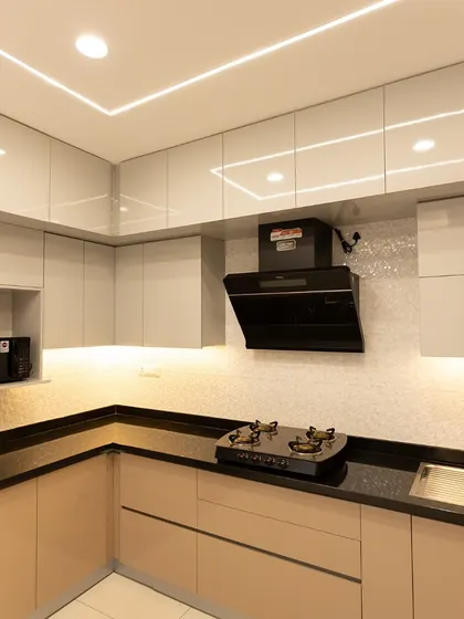 This beige kitchen is for all the Pinterest lovers. The neutral color serves as a timeless backdrop, reflecting light to make the space feel open and inviting, while the integrated lighting adds a touch of modern luxury.