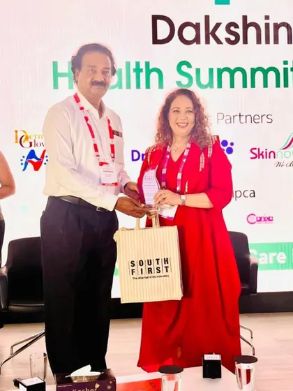 Receiving an award at the Dakshin Health Summit 2025. I am grateful for the recognition of my contributions to the field.