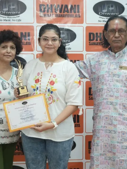 An adult student with her mother and guru, celebrating her musical journey.