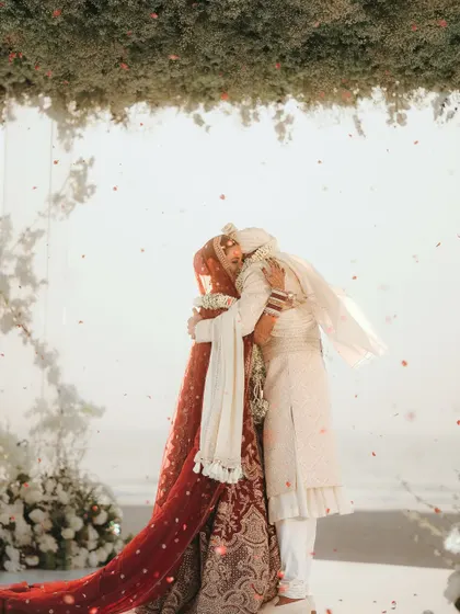 An emotional hug after the ceremony. These are the real, unscripted moments that tell the true story of the day.