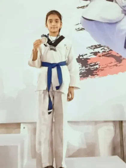 Naysha proudly displaying her silver medal from the CBSE Nationals. Another national-level achievement for her.