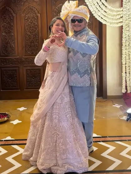 Dressing up couples is what we do best. This pastel look features a pale pink chikankari lehenga for her and a powder blue kurta with a sequined Nehru jacket for him.