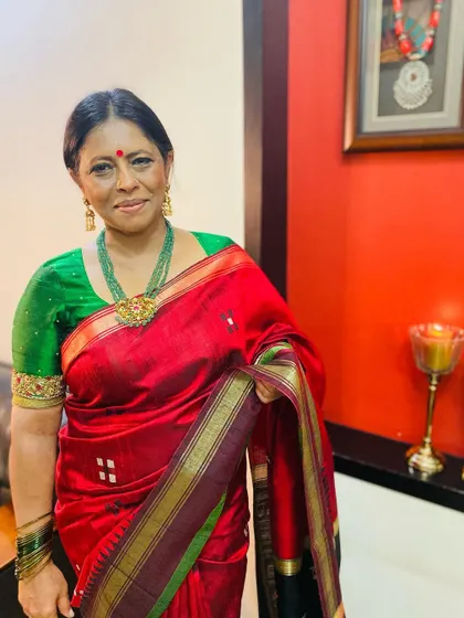 For Day 2 of Navratri, I chose this rich red pure dupion silk saree, paired with a green blouse and a masterpiece jewellery set I designed.