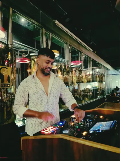 Here I am at a popular brewery, where the vibe is a bit more open. I adjust my set to fit the venue, blending dance music with more accessible tracks.