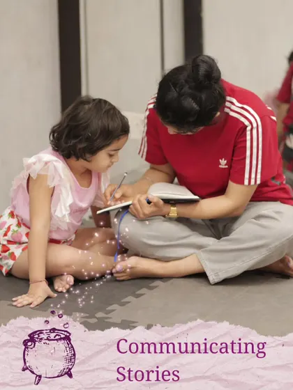 Communicating stories is at the heart of what we do. Here, a facilitator helps a young child write down her ideas, valuing her contribution to the script.
