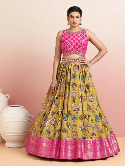 A full-length view of the mustard and pink floral lehenga, a vibrant and festive choice for any celebration.
