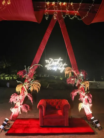 Every event needs a great photo opportunity. We created this chic photo booth with a bold red backdrop and a custom neon sign, providing a fun and stylish spot for guests to capture memories.