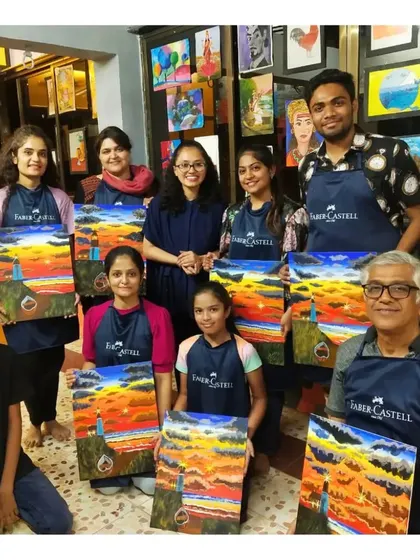Art is a celebration here. This is a glimpse into one of our lively workshops where artists of all ages and skill levels come together to learn, create, and proudly display their finished canvas paintings.