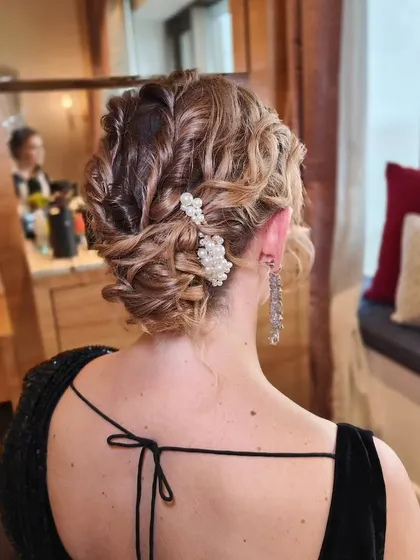 Another view of the textured updo, showing the beautiful waves and twists from the back. This style has great volume and looks stunning from every angle.