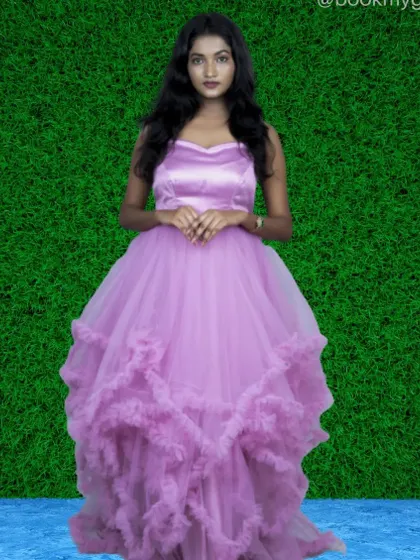 A lilac ruffle gown with a fitted satin bodice. The cascading ruffles on the skirt add playful movement and volume.