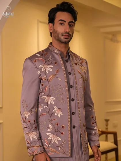 Our mauve Jodhpuri ensemble is a testament to detailed craftsmanship. The intricate floral embroidery and beadwork create a sophisticated look that is both unique and timeless.