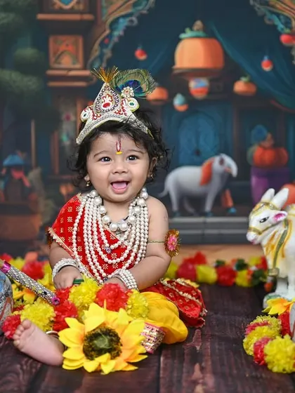 This little one dressed as Krishna is one of my most requested photoshoots. I love how the vibrant colours, detailed props, and the baby's joyful expression come together to create such a special portrait for Janmashtami.