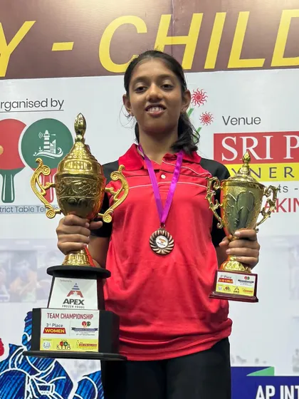 Celebrating a fantastic double win for our paddler Eshaa at the Andhra Pradesh State Ranking Tournament. She proudly displays her trophies for winning Gold in the Under 17 Girls Singles and Bronze in the Under 19 category.